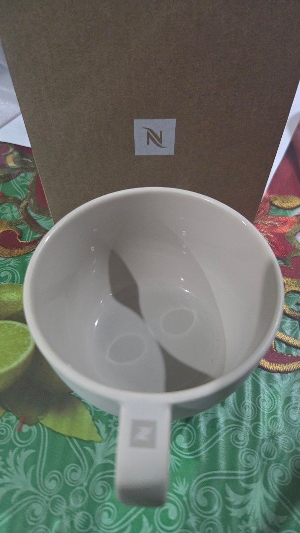 Nespresso Barista Cappuccino Medium Cup (Category: Coffee & Tea Tableware) located in Quezon City. Submitted by liquidatormnl (Listing ID 1470268349, Image 2). Description: - Brand: Nespresso Barista - Item: Medium cappuccino cup - Material: Porcelain - Color: Neutral off-white with logo on handle - Condition: Brand new, never used, stored properly - Inclusions: Original brown cardboard box - Perfect addition to your daily coffee setup.