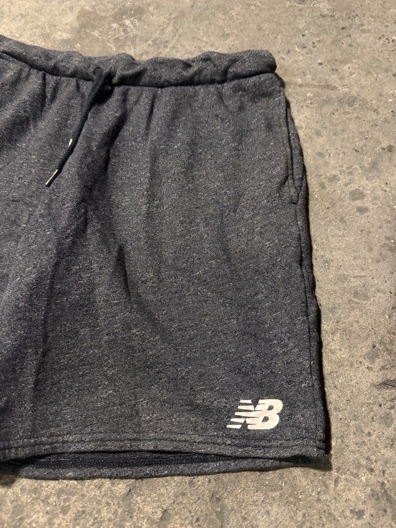 New Balance dark grey short (Category: Shorts) located in Pasig City. Submitted by dripthrift1600 (Listing ID 1470319672, Image 3). Description: - New balance grey short - Good condition - Issue: None - Sizes: M - Dimes: 32x17.