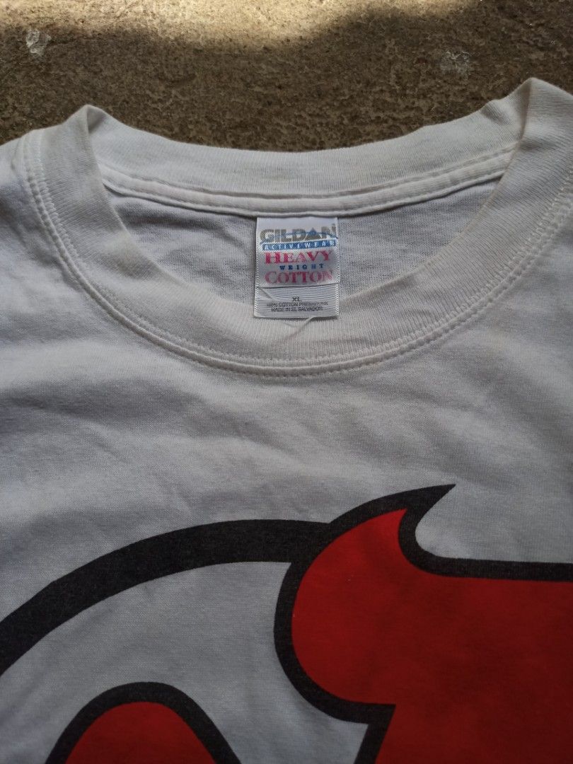 New Jersey Devils NHL Tee (Category: Tshirts & Polo Shirts ) located in Manila. Submitted by tuazonjohn12680 (Listing ID 1470182568, Image 3). Description: Tag: Gildan Heavy Weight Cotton XL Size: XL on tag (fits L-XL) if needed Color: White Condition: 8.5/10 Good vintage condition Details: - Official NHL Licensed (with ®) - Big Logo Print - Early 2000s Y2K Tag - Championship era (Devils won Stanley Cup 2000 & 2003) - No major holes/stains - need