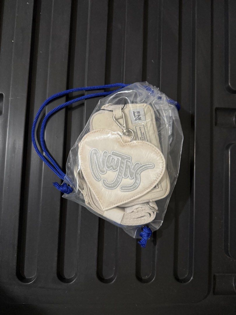 newjeans coller wallet oatmeal cream (Category: K-Wave Merchandise) located in Quezon City. Submitted by switchnin (Listing ID 1470252099, Image 2). Description: brand new with tags.