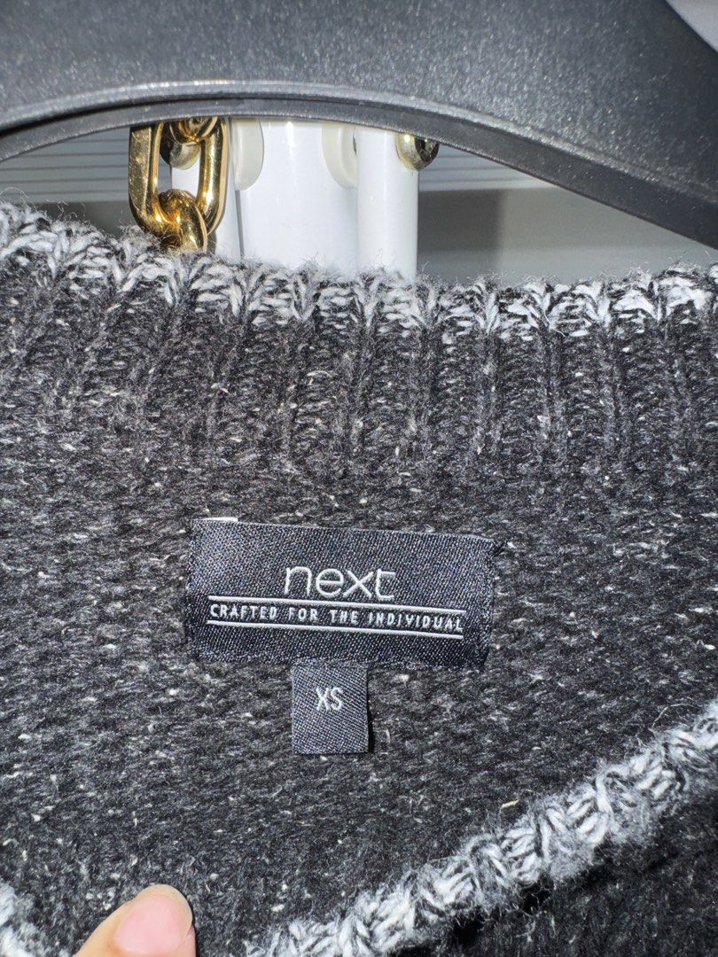 Next Black and Grey Fair Isle Pattern Knit Sweater (Category: Longsleeves) located in La Trinidad. Submitted by prelovedandfindsbyji (Listing ID 1470221442, Image 2). Description: Next knit sweater, size extra small. Black upper section fading into a patterned grey and black snowflake knit body and sleeves. Long sleeves with ribbed crew neck collar. Material blend of acrylic, cotton, wool, and silk. Care tag specifies machine wash on wool cycle i