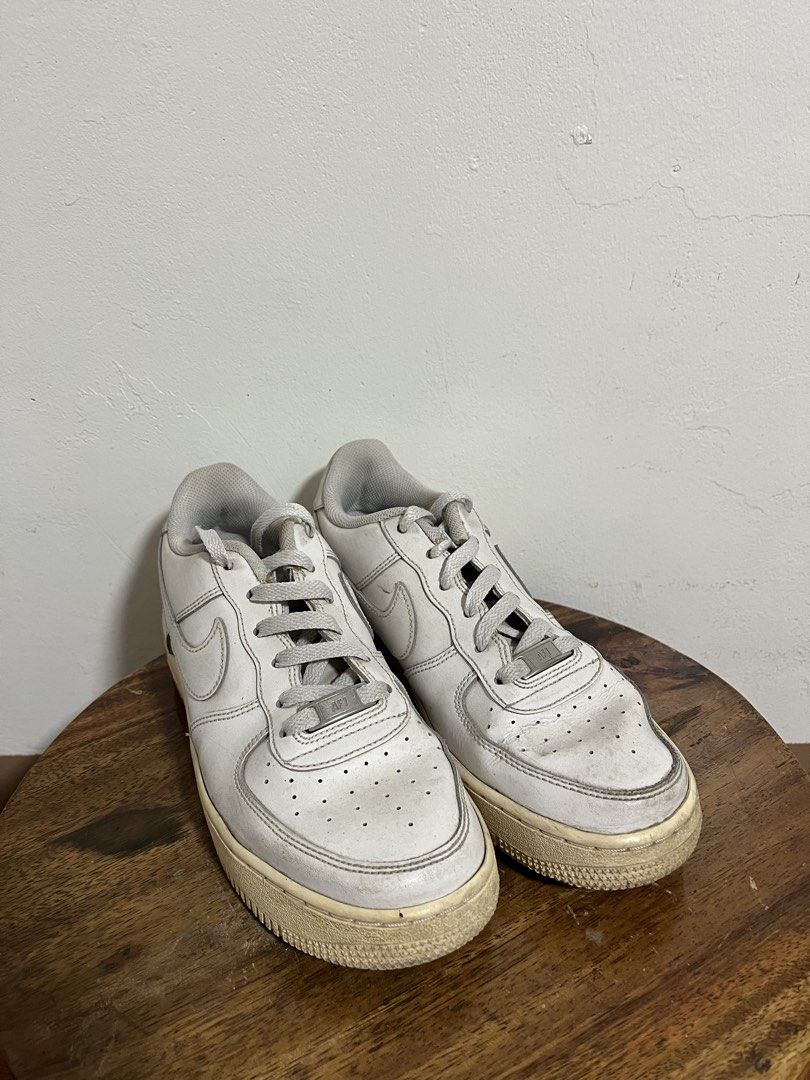 Nike Air Force 1 Low White (Category: Sneakers) located in Cabuyao City. Submitted by rdtrmt (Listing ID 1470180626, Image 1). Description: - Model: Nike Air Force 1 Low - Colorway: Classic Triple White - Details: Iconic low-top silhouette, leather upper, perforated toe box, tonal laces, and AF1 metal lace deubrés - Condition: Visible yellowing on soles from age and wear, plus creasing across the toe boxes - Best Use: Great daily beater pair for 