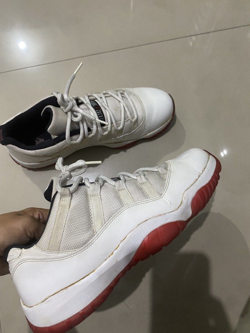 Nike Air Jordan 11 Retro Low Cherry (Category: Sneakers) located in Pasig City. Submitted by alhers.417 (Listing ID 1470256910, Image 2). Description: For sale Jordan 11 low White and red Air Jordan 11 lows. Patent leather mudguard paired with mesh uppers. Red translucent outsoles with herringbone traction pods. Black inner lining and heel tabs with red Jumpman branding. Number 23 on the heels. Regular lace-up closure. Noticeable creasing on leat