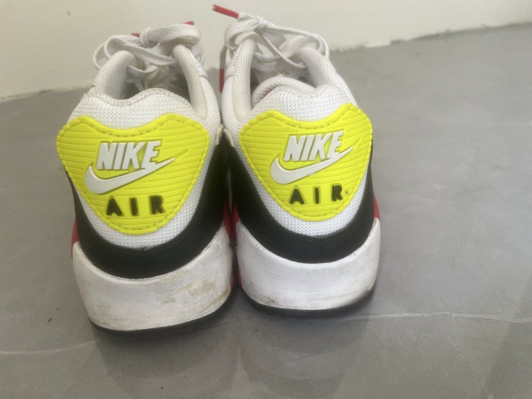 Nike Air Max 90 White Volt Pink (Category: Sneakers) located in Bulacan. Submitted by jhemieee (Listing ID 1470191401, Image 3). Description: - Brand/Model: Nike Air Max 90 - Colorway: White, black, pink, and bright yellow - Design: Classic retro runner with visible heel air unit - Materials: Mesh and leather upper construction - Condition: Uppers and laces are clean; soles and midsoles show normal wear, scuffing, and dirt from regular use.