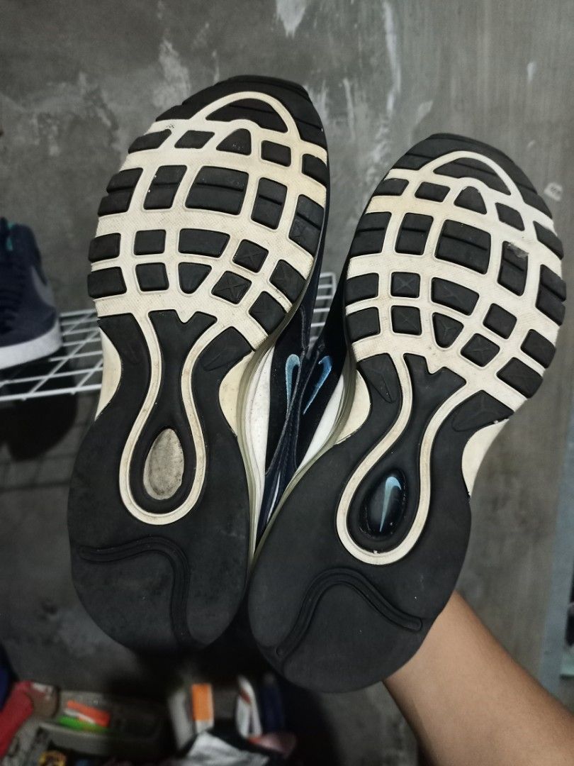 Nike Air Max 97 Black Blue Size US 9.5 (Category: Sneakers) located in Mabalacat. Submitted by hasashoe (Listing ID 1470280959, Image 2). Description: - Brand/Model: Nike Air Max 97 - Colorway: Black with blue accents and white midsoles - Size: US 9.5 / UK 8.5 / EUR 43 - Condition: Pre-owned with visible wear on the white midsoles and soles - Features: Classic wavy upper design, cushioning units fully intact - Note: Great, reliable pair for daily