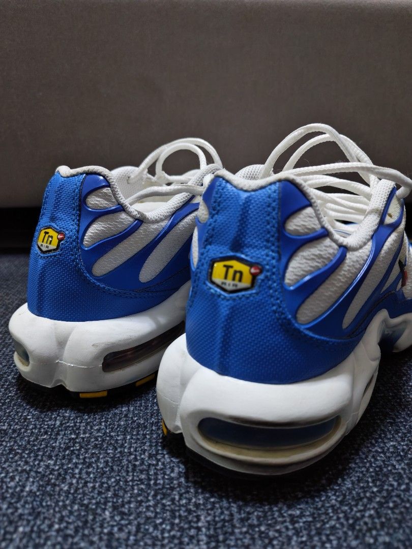 Nike Air Max Plus TN White Blue (Category: Sneakers) located in Manila. Submitted by kdsgadgethub (Listing ID 1470322741, Image 3). Description: - Model: Nike Air Max Plus (Tn) - Colorway: White and Blue with classic orange swoosh outline - Key Features: Iconic wavy cage overlay, signature Tn Air branding on heel and tongue - Cushioning: Visible Max Air units in the midsole for all-day comfort - Sole: Clean white rubber outsole with crisp white l