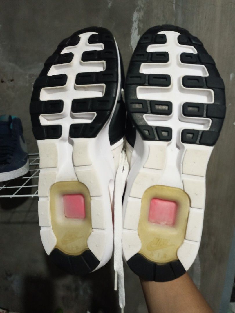 Nike Air Max Zero White Black Crimson Size US 9 (Category: Sneakers) located in Mabalacat. Submitted by hasashoe (Listing ID 1470284002, Image 3). Description: - Model: Nike Air Max Zero - Colorway: White, Black, and Crimson Orange - Size: Men's US 9 / UK 8 / EUR 42.5 - Features: Heel air-cushion unit with reddish-pink accents and classic back pull tab - Condition: Soles show minor wear on tread, with slight yellowing around the air bubble window