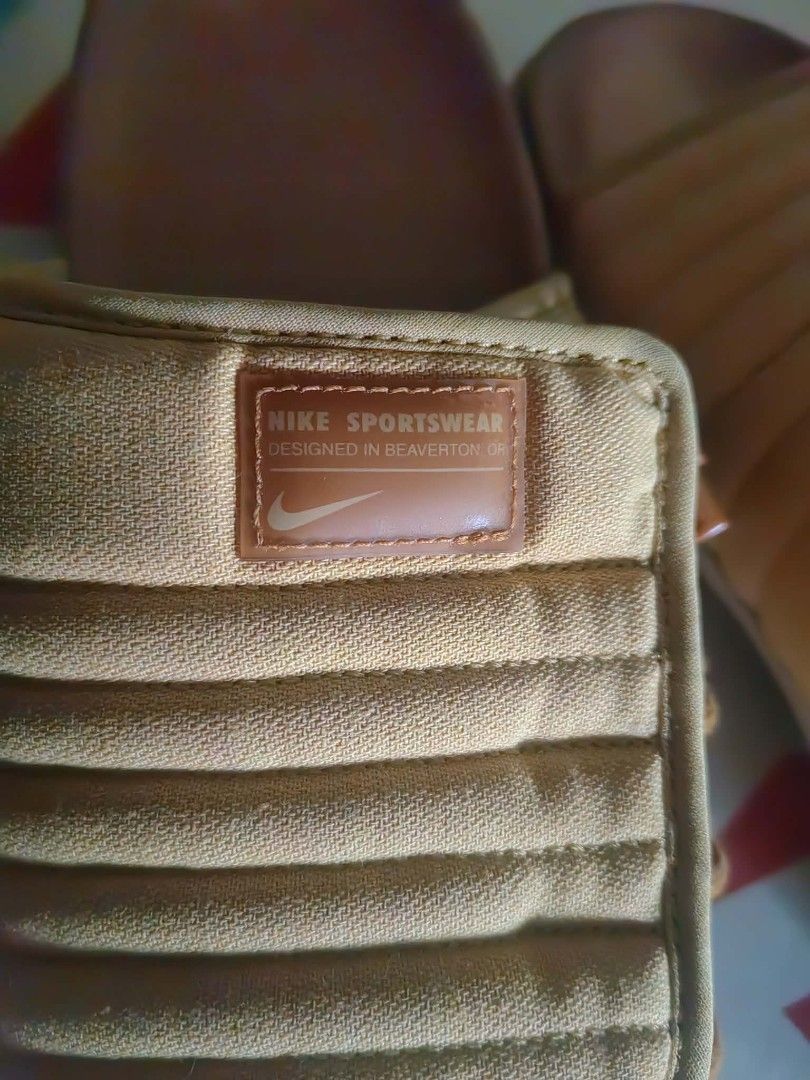 Nike Asuna 2 Slide Wheat Gold Size 9 (Category: Slippers & Slides) located in Manila. Submitted by judejose0203 (Listing ID 1470303379, Image 3). Description: - Brand: Nike - Model: Asuna 2 Slides - Colorway: Wheat Gold / Team Gold - Size: US 9 / UK 8 / EUR 42.5 - Condition: Brand new with original red Nike shoebox - Features: Padded strap with adjustable side toggle system and Nike Sportswear logo patch - Style: Super comfortable slip-on sandals