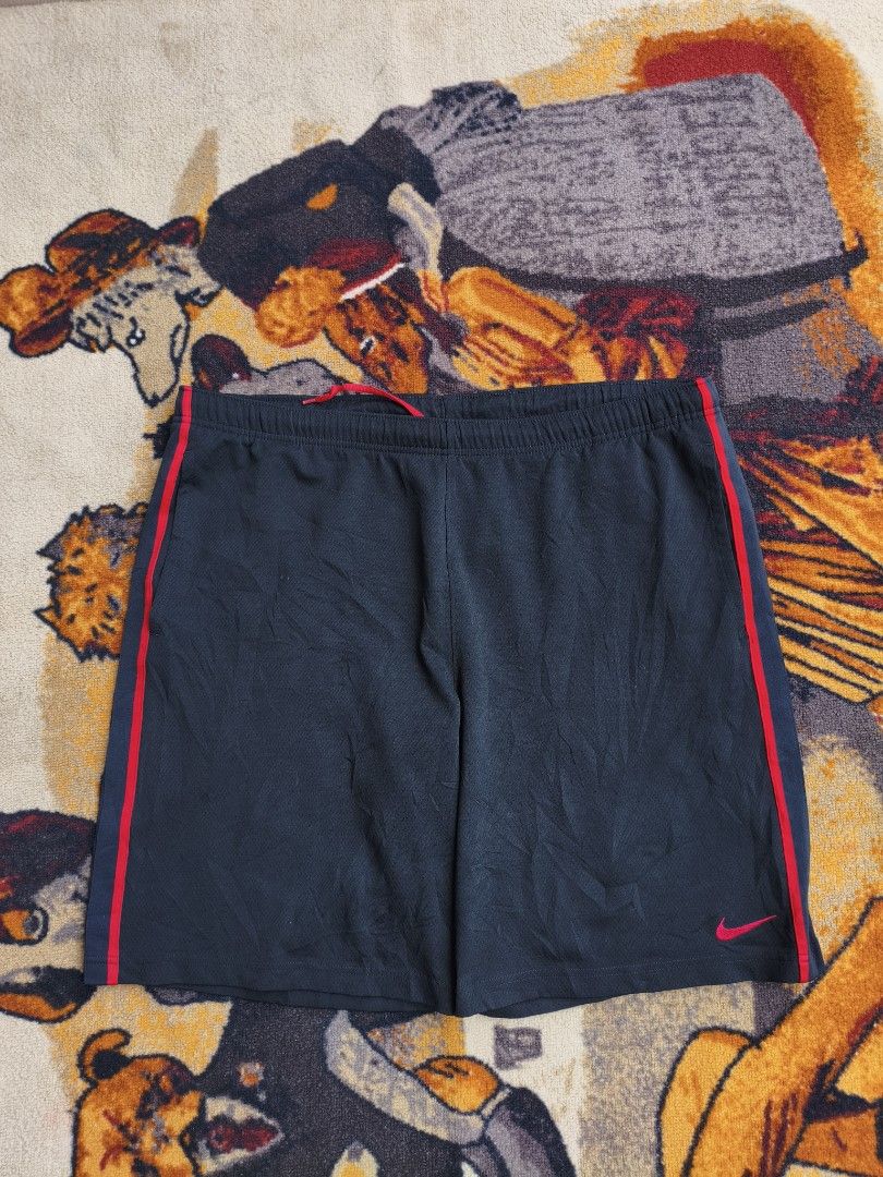 Nike Black and Red Athletic Shorts Size L (Category: Shorts) located in Davao. Submitted by simonandre53791 (Listing ID 1470253272, Image 3). Description: - Brand: Nike - Color: Black with red piping and embroidered red swoosh - Size: L (Large) - Features: Elastic waistband with internal drawstring, smooth and breathable fabric - Ideal for: Gym workouts, running, or casual everyday wear.