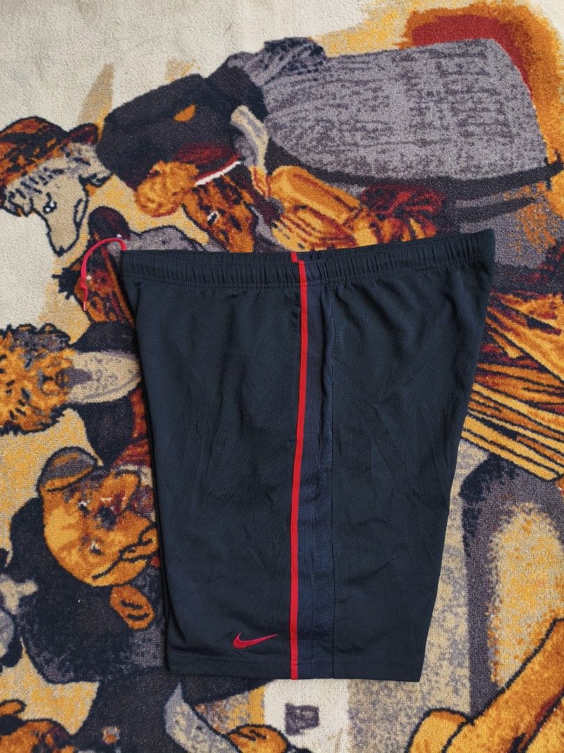 Nike Black and Red Athletic Shorts Size L (Category: Shorts) located in Davao. Submitted by simonandre53791 (Listing ID 1470253272, Image 1). Description: - Brand: Nike - Color: Black with red piping and embroidered red swoosh - Size: L (Large) - Features: Elastic waistband with internal drawstring, smooth and breathable fabric - Ideal for: Gym workouts, running, or casual everyday wear.