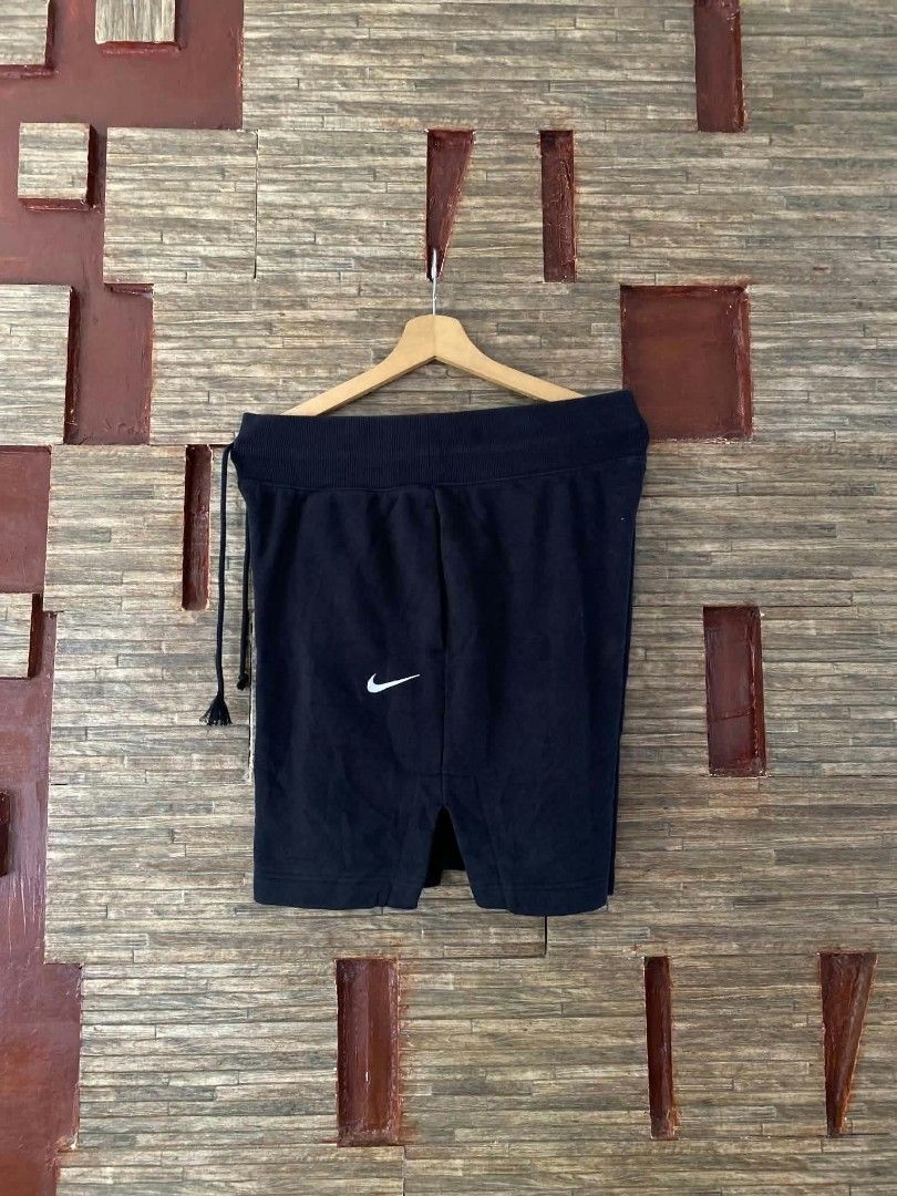 Nike Black Athletic Shorts (Category: Shorts) located in Alegria. Submitted by happypenguin-d20d (Listing ID 1470215215, Image 1). Description: - Color: Black - Brand: Nike - Features: Thick elastic waistband with drawstring closure, white embroidered Nike swoosh logo, and split hem detail - Style: Comfortable and sporty, ideal for workouts or daily wear - Condition: Good overall condition.