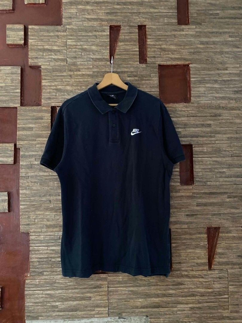 Nike Black Polo Shirt (Category: Tshirts & Polo Shirts ) located in Alegria. Submitted by happypenguin-d20d (Listing ID 1470214746, Image 1). Description: - Brand: Nike - Color: Black with white embroidered swoosh on the chest - Fit: Standard fit, short sleeves - Design: Classic collar and button placket - Condition: Clean overall look - Style: Versatile basic, easy to pair with jeans or shorts for casual and smart-casual outfits.