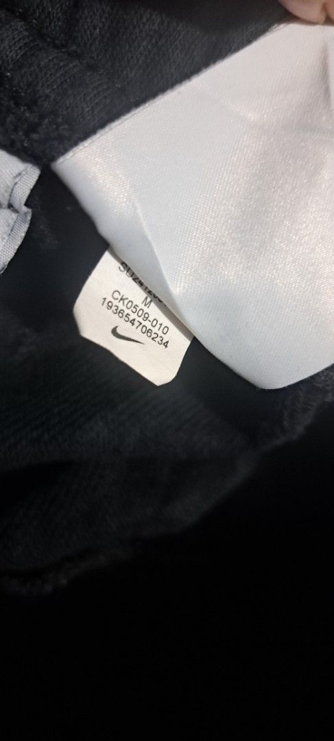 Nike Black Shorts Size M (Category: Shorts) located in San Fernando, Camarines Sur. Submitted by ladderaya (Listing ID 1470241437, Image 3). Description: - Brand: Nike - Color: Black - Size: Youth Medium (fits heights 140-150cm) - Design: Large grey & white Nike logo on left leg - Features: Adjustable drawstring waist with side pockets - Material: 80% cotton, 20% polyester blend - Style Code: CK0509-010 - Condition: Clean with tags attached.