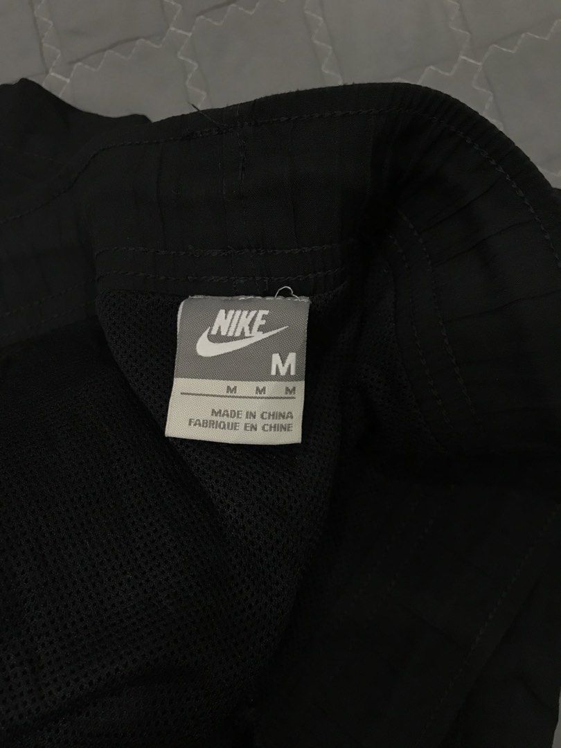 Nike Black Track Pants Size M (Category: Joggers) located in Imus. Submitted by yoboi.04 (Listing ID 1470225895, Image 3). Description: - Brand: Nike - Item: Track Pants - Color: Black - Size: Medium - Fit: Standard relaxed fit - Material: 100% polyester with breathable mesh lining - Features: Elastic waistband and trendy side panel details - Condition: Clean fabric inside and out, well-maintained - Style Code: 259887-010 - Trusted seller: Buy wi