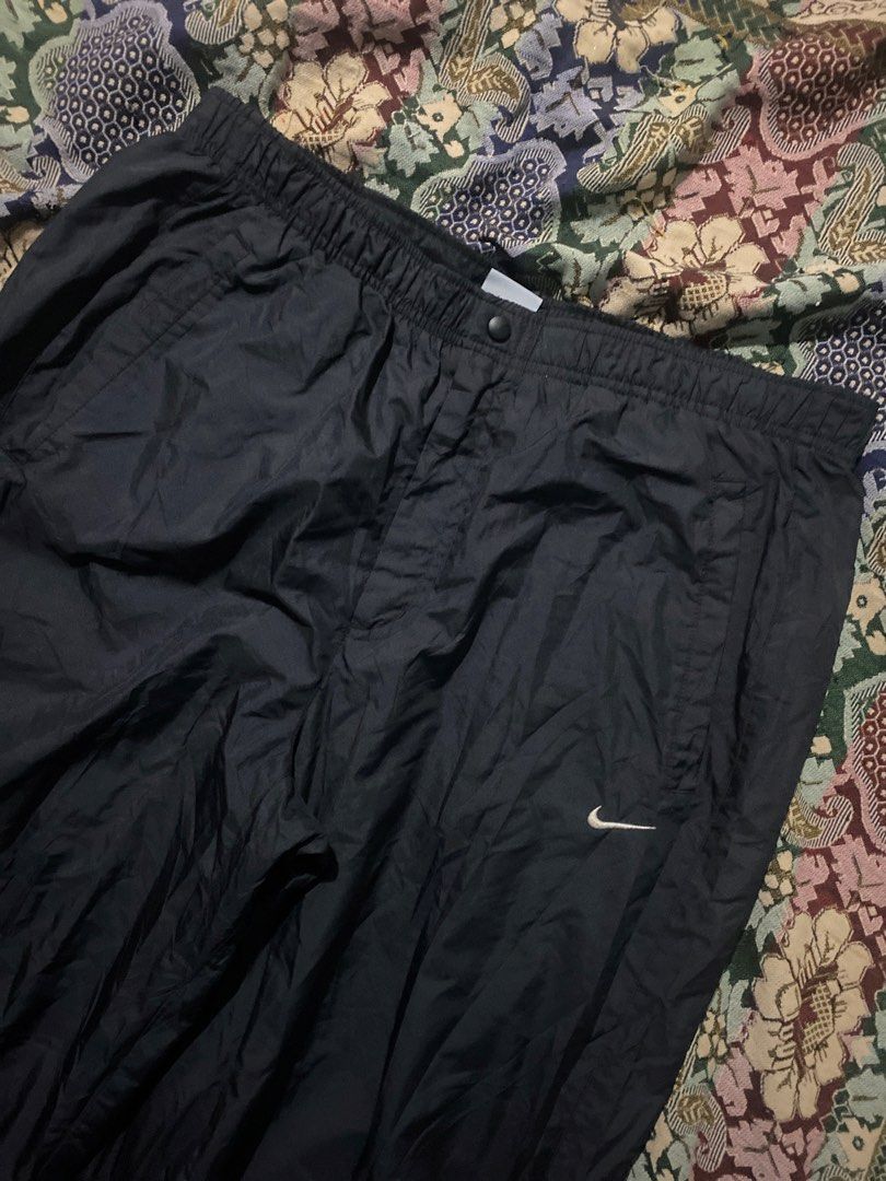 Nike Black Windbreaker Pants Drawstring Cuffs XL (Category: Joggers) located in Manila. Submitted by zhu.finds (Listing ID 1470249122, Image 2). Description: - Brand: Nike - Item: Track Pants - Color: Black - Size: XL - Waistband: Elastic with snap button closure - Cuffs: Adjustable drawstring at the ankles - Interior: Breathable mesh lining - Origin: Made in Vietnam - Condition: Excellent / Ready to wear.
