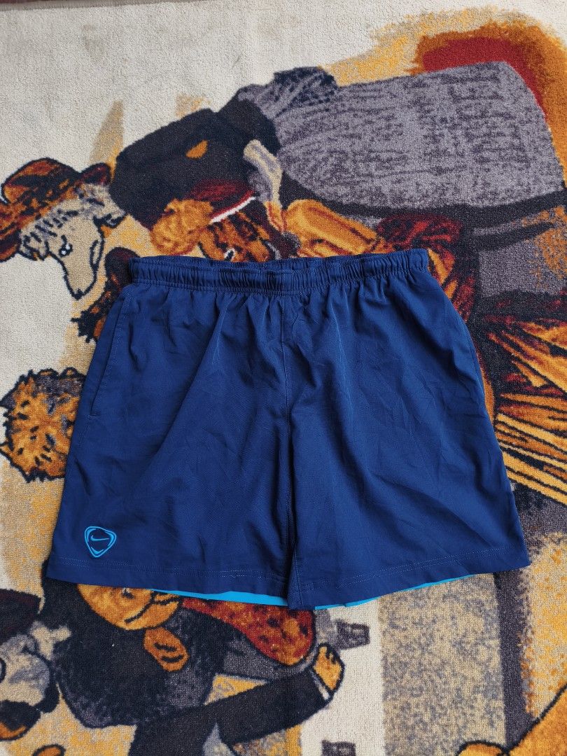 Nike Blue Athletic Shorts Size L (Category: Shorts) located in Davao. Submitted by simonandre53791 (Listing ID 1470253239, Image 1). Description: - Brand: Nike - Color: Bright blue with logo detail near the hem - Size: Large - Material: Lightweight fabric - Fit: Elastic waistband for a comfortable fit - Ideal for: Workouts or casual lounging - Origin: Made in Indonesia - Condition: Clean, ready to wear.