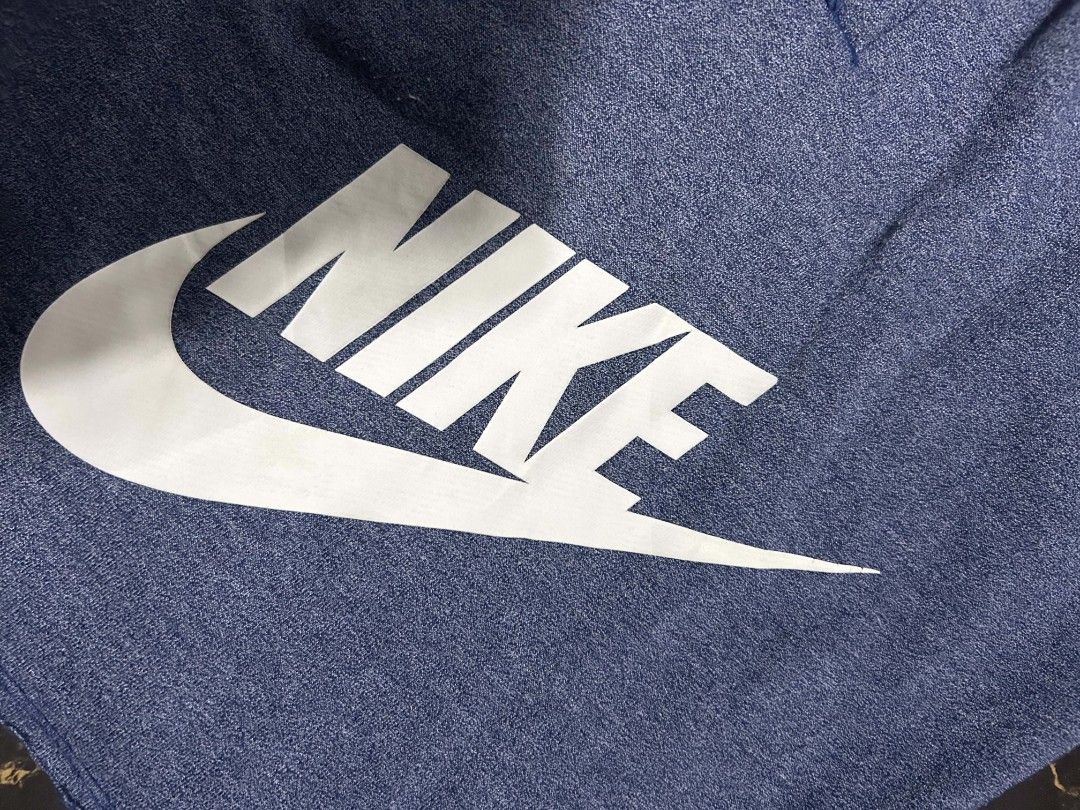 Nike Blue Heathered Shorts XL (Category: Shorts) located in Manila. Submitted by marjoriete27817 (Listing ID 1470310369, Image 3). Description: - Brand: Nike - Size: XL -waist line 36 length 20.5 - Color/Style: Blue heathered fleece - Material: Cotton and lyocell blend - Features: Drawstring waistband, side pockets - Condition: Minor cracking on the white Nike logo near the tail end of the swoosh - Origin: Made in Thailand.
