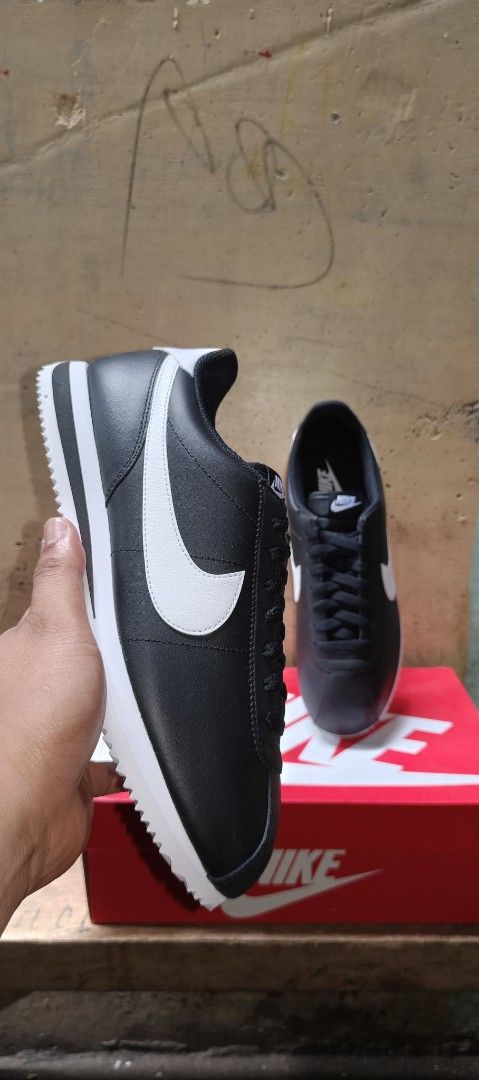 Nike Cortez Leather Black White (Category: Sneakers) located in Paranaque City. Submitted by lukatogbits15 (Listing ID 1470303445, Image 2). Description: - Brand: Nike - Model: Cortez - Color: Black and white with white swoosh and heel tab - Material: Classic leather upper - Design: Iconic running shoe style with serrated sole - Packaging: Comes in original Nike red box - Condition: Clean and stylish.