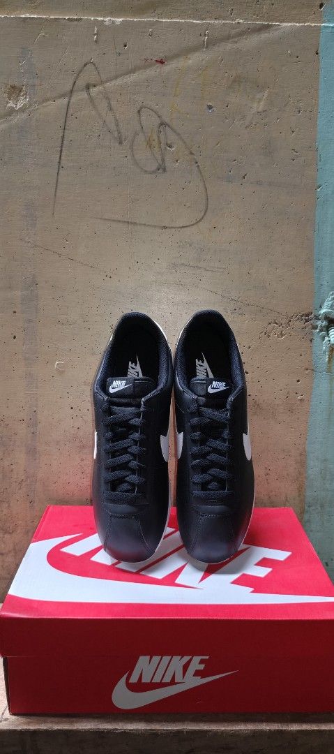 Nike Cortez Leather Black White (Category: Sneakers) located in Paranaque City. Submitted by lukatogbits15 (Listing ID 1470303445, Image 1). Description: - Brand: Nike - Model: Cortez - Color: Black and white with white swoosh and heel tab - Material: Classic leather upper - Design: Iconic running shoe style with serrated sole - Packaging: Comes in original Nike red box - Condition: Clean and stylish.