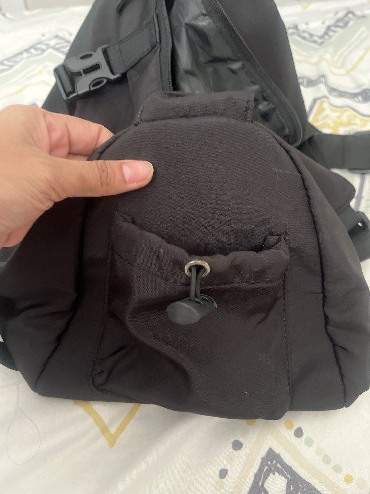 Nike crossbody bag (Category: Cross-body Bags) located in Pasig City. Submitted by jnzmrq1003 (Listing ID 1470209849, Image 3). Description: ✔️ Classic black design with white Nike logo ✔️ Spacious main compartment ✔️ Multiple zippered pockets for organizing essentials ✔️ Adjustable straps with buckle details ✔️ Lightweight and practical for everyday use, errands, and travel ✔️ Nike-branded interior lining.