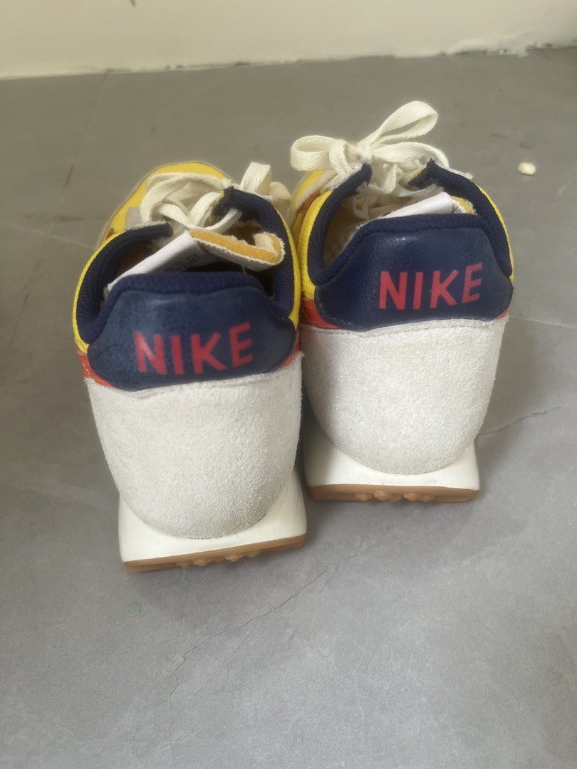 Nike Daybreak Yellow Red Navy Sneakers (Category: Sneakers) located in Bulacan. Submitted by jhemieee (Listing ID 1470192159, Image 2). Description: - Bright yellow mesh upper with stylish grey suede overlays - Eye-catching red swoosh and navy blue heel tab for contrast - Comfortable foam midsole and classic waffle-pattern gum rubber outsole - Vintage runner aesthetic that stands out - Fitted with neat, clean white laces - DM for size, availabili