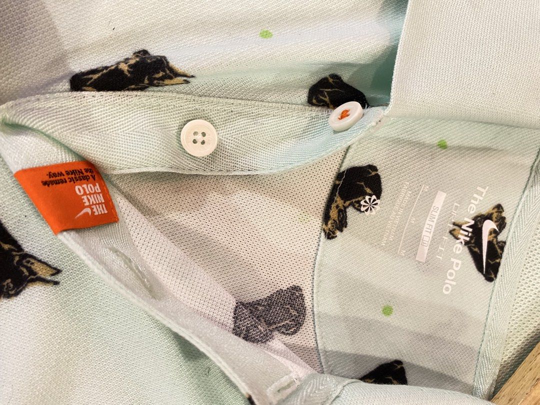 Nike Dri-FIT Slim Fit Doberman (Category: Tshirts & Polo Shirts ) located in Manila. Submitted by thriftvibes324 (Listing ID 1470244071, Image 3). Description: - Brand: Nike - Style: Slim fit polo with Doberman dog print and green dot pattern - Color: Light blue - Size: M - Material/Tech: Dri-FIT fabric to keep you dry - Details: Standard collar with 2 buttons, orange side tab - Style Code: DQ4577-379 - Condition: Clean and well-kept.