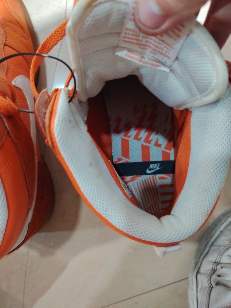 Negotiable! Nike Dunk High Orange Sneakers (Category: Sneakers) located in Las Pinas. Submitted by aiigoo (Listing ID 1470313272, Image 2). Description: NEGOTIABLE!!! - Brand: Nike - Style: High-top basketball sneakers - Color: Bright orange with white swoosh branding - Material: Suede and leather overlays - Features: Contrast patterned insole with Nike logo and thick rubber sole for traction - Closure: Standard lace-up front with matching orange