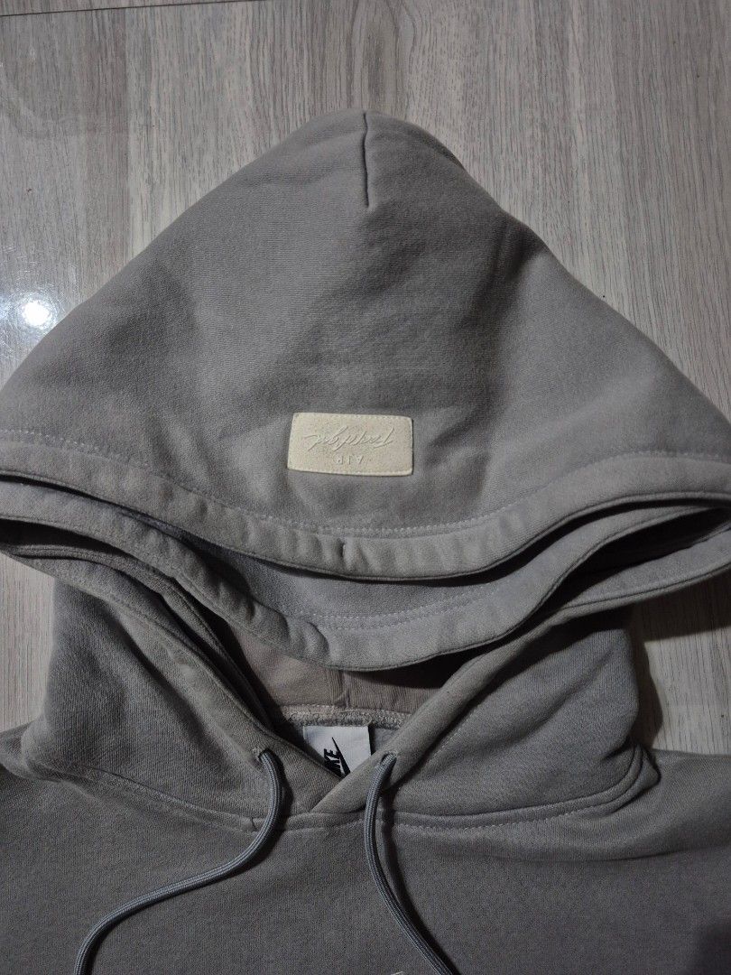Nike FOG (Category: Hoodies) located in Taguig. Submitted by kai.exe (Listing ID 1470306272, Image 2). Description: Nike Fear of God double hoodie Size Small on tag 🏷️ Dimes Width 23 Length 26 Brandnew condition Color rate 9.8 or better No issue or stain Original/Authentic PM for more details❗❗❗.
