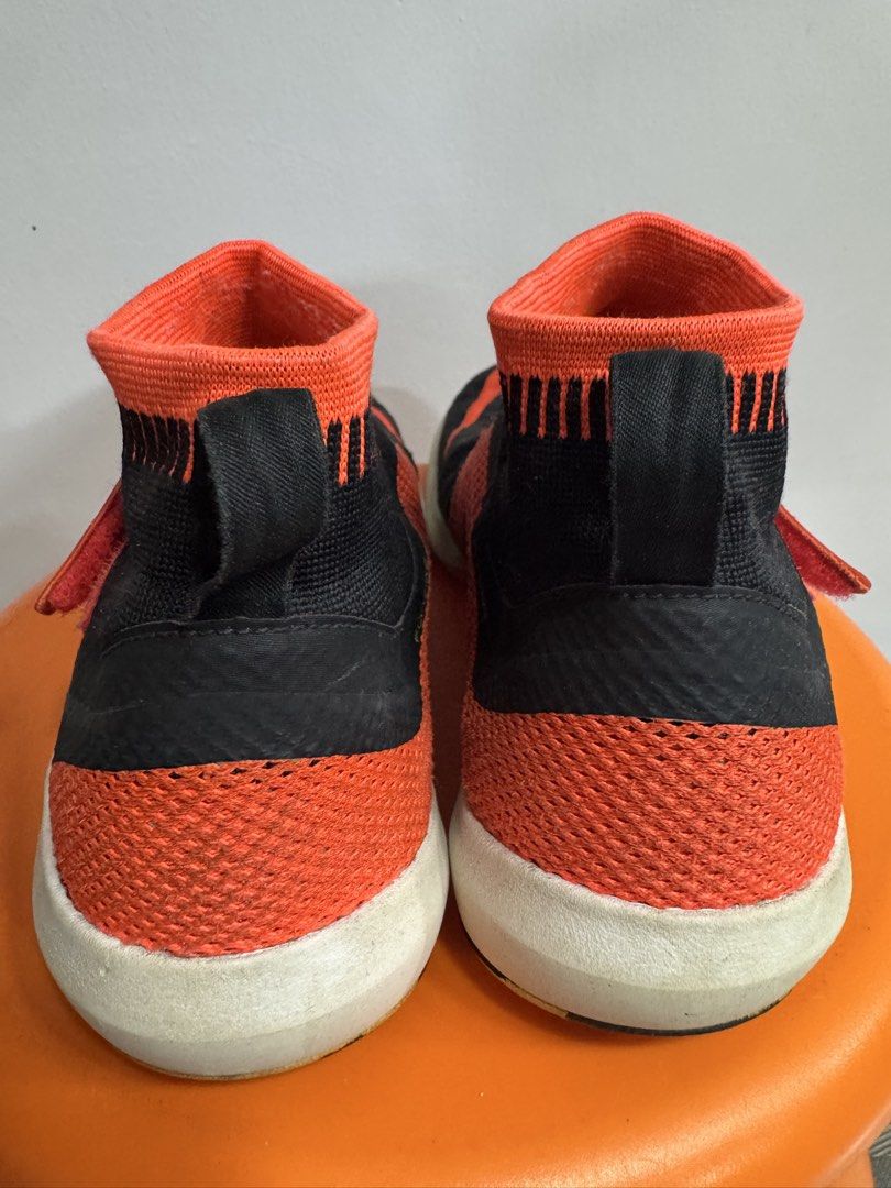 Nike Free Flyon Training Shoes Black Orange (Category: Sneakers) located in Valenzuela. Submitted by sofiasticated.decluttering (Listing ID 1470163126, Image 2). Description: - Brand: Nike Training Shoes - Colorway: Black with bright orange, neon green, and white accents - Design: High-top sockliner with Flywire lacing system and fabric heel pull tabs - Branding: Bright orange swoosh on the sides and toe box - Sole: White Free Flylon midsoles - C