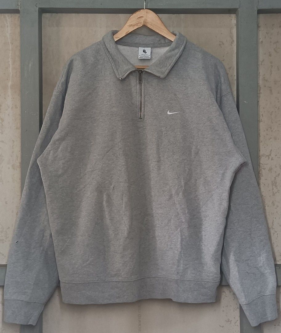 Nike Gray Half Zip Sweatshirt M-T (Category: Coats, Jackets and Outerwear) located in Muntinlupa City. Submitted by thriftben (Listing ID 1470204708, Image 1). Description: - Brand: Nike - Style: Half-zip sweatshirt with collared neck and branded metal zipper pull - Color: Grey with small embroidered white swoosh on chest - Size: Medium Tall - Material: Comfortable cotton and polyester blend with ribbed cuffs and hem - Style Code: DQ5209-063 - Or