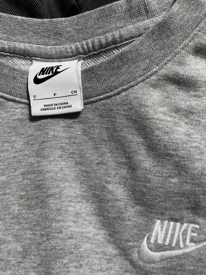 Nike Grey Sweatshirt Crewneck Size S (Category: Coats, Jackets and Outerwear) located in Davao. Submitted by vin.my (Listing ID 1470338248, Image 2). Description: Grey Nike crewneck sweatshirt in size S. Features a white embroidered chest logo and ribbed detailing. Perfect for everyday layering..