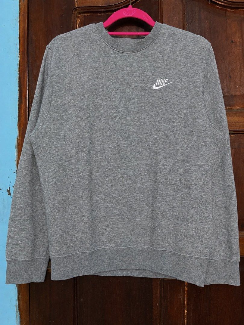 Nike Grey Sweatshirt Crewneck Size S (Category: Coats, Jackets and Outerwear) located in Davao. Submitted by vin.my (Listing ID 1470338248, Image 1). Description: Grey Nike crewneck sweatshirt in size S. Features a white embroidered chest logo and ribbed detailing. Perfect for everyday layering..