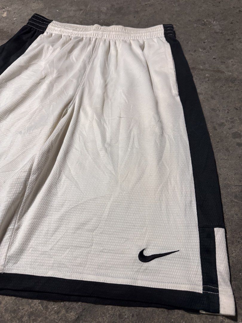 Nike jersey white short (Category: Shorts) located in Pasig City. Submitted by dripthrift1600 (Listing ID 1470316105, Image 3). Description: - Nike Jersey White short - Good condition - Issue: stain / needwash - Sizes: L - Dimes: 28x22.
