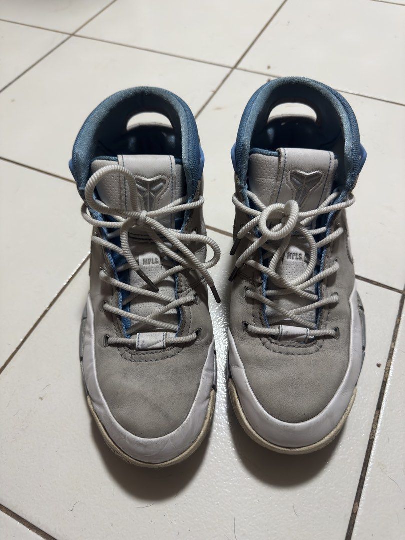 Nike Kobe 1 Protro MPLS Grey Blue Size 9.5 (Category: Sneakers) located in Manila. Submitted by mislangers_stuff (Listing ID 1470208212, Image 2). Description: - Model: Nike Kobe 1 Protro (MPLS colorway) - Size: US 9.5 / UK 8.5 / EUR 43 / 27.5 cm - Color: Grey and light blue with white Swoosh and 'MPLS' branding - Details: Leather upper, Zoom Air cushioning, carbon fiber shank plate, and Kobe sheath logo - Condition: Upper shows creasing and wear