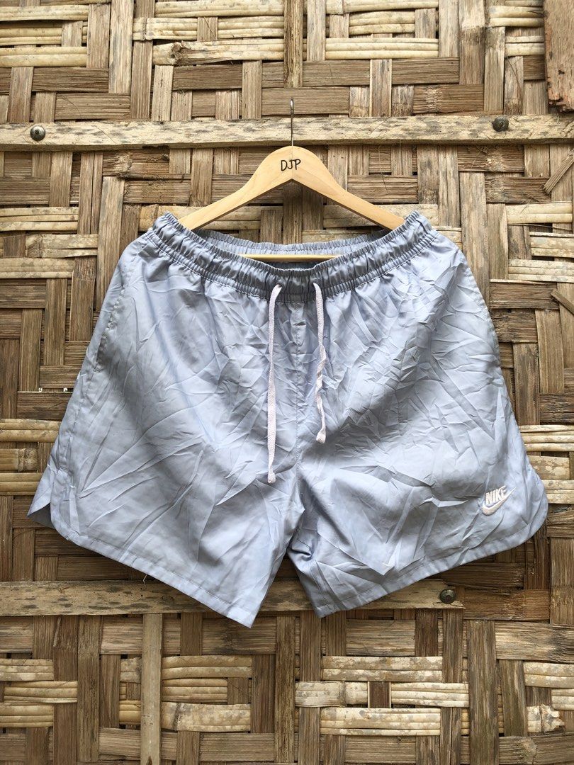Nike Light Blue Nylon Athletic Shorts (Category: Shorts) located in Digos. Submitted by villasurdajayvee (Listing ID 1470221771, Image 1). Description: - Brand: Nike - Color: Light Blue - Size: XL - Condition: Great casual or workout piece - Material: Lightweight fabric with breathable inner mesh lining - Features: Elastic waistband with branded white drawstring, two side pockets, and embroidered Nike logo near the hem - Origin: Made in China.