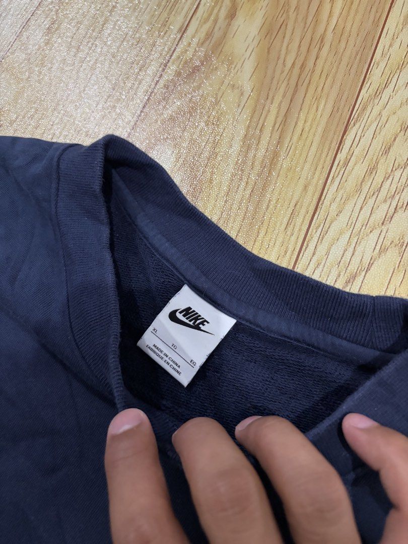 Nike Multi Swoosh Navy Sweatshirt (Category: Coats, Jackets and Outerwear) located in Caloocan City. Submitted by jerichotad22965 (Listing ID 1470194457, Image 3). Description: - Brand: Nike - Color: Navy blue with red and white stacked multi-swoosh embroidery - Size: XL (Standard fit) - Material: 88% cotton, 12% polyester blend - Details: Ribbed crewneck, cuffs, and hem - Condition: Excellent, PM for inquiries!.