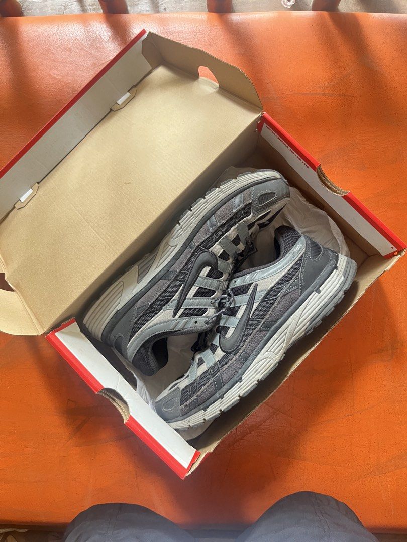 Nike P-6000 Black Grey Sneakers with Box (Category: Sneakers) located in Iloilo. Submitted by matthewyap53343 (Listing ID 1470195245, Image 2). Description: - Model: Nike P-6000 running shoes - Colorway: Black and Grey - Style: Chunky retro silhouette featuring mesh and suede overlays - Fit: True to size - Condition: Clean overall with minimal wear on the soles - Inclusion: Comes with original Nike shoebox.