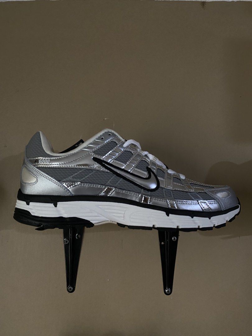 Nike P-6000 Metallic Silver Black Sneakers (Category: Sneakers) located in Manila. Submitted by rovinxrx (Listing ID 1470295846, Image 1). Description: - Model: Nike P-6000 - Colorway: Metallic Silver and Black with white laces and midsole - Design: Mixed mesh and leather upper, iconic black Nike swoosh, and chunky outsole - Branding: P-6000 logo on the heel - Condition: Clean and well-maintained - Perfect for daily wear and street style.