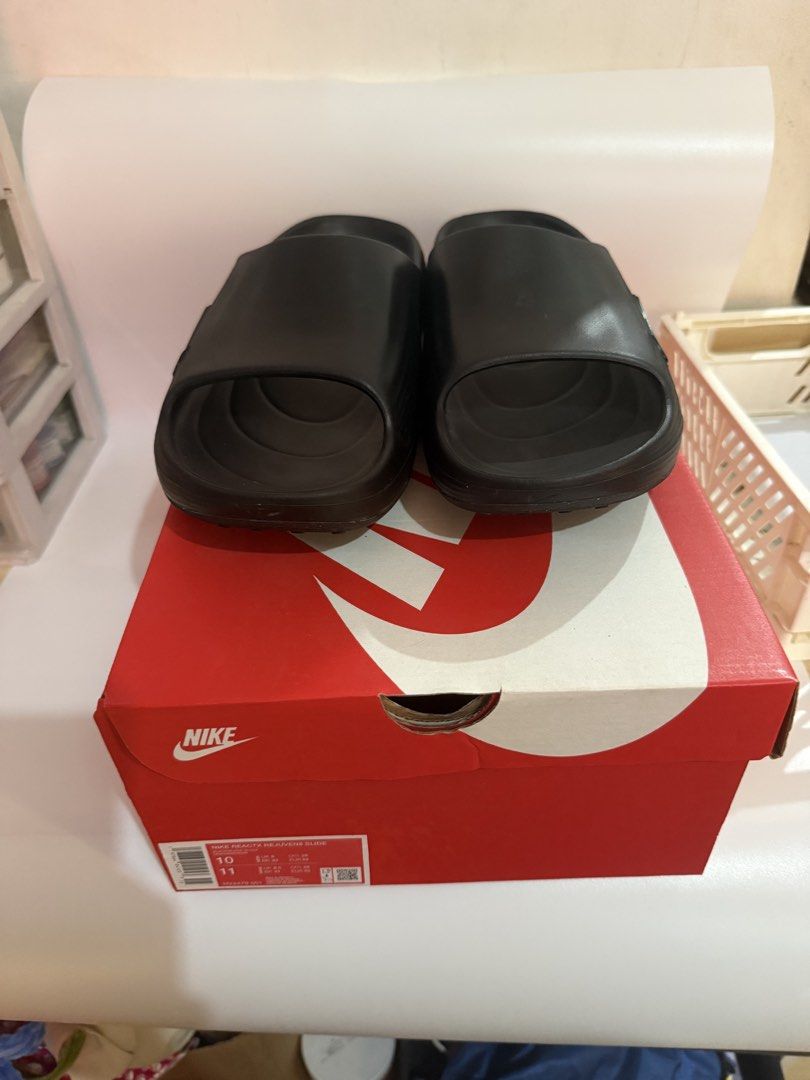 Nike ReactX Rejuven8 Slide Black Size 10 (Category: Slippers & Slides) located in Pasay City. Submitted by ellianapenelope (Listing ID 1470206832, Image 2). Description: - Item: Nike ReactX Rejuven8 Slides - Color: Black - Size: Men's US 10 / Women's US 11 - Condition: Brand new with original red and white Nike box - Comfort: Highly cushioned footbed with signature ReactX branding - Traction: Wavy textured sole underneath for enhanced grip - Perf