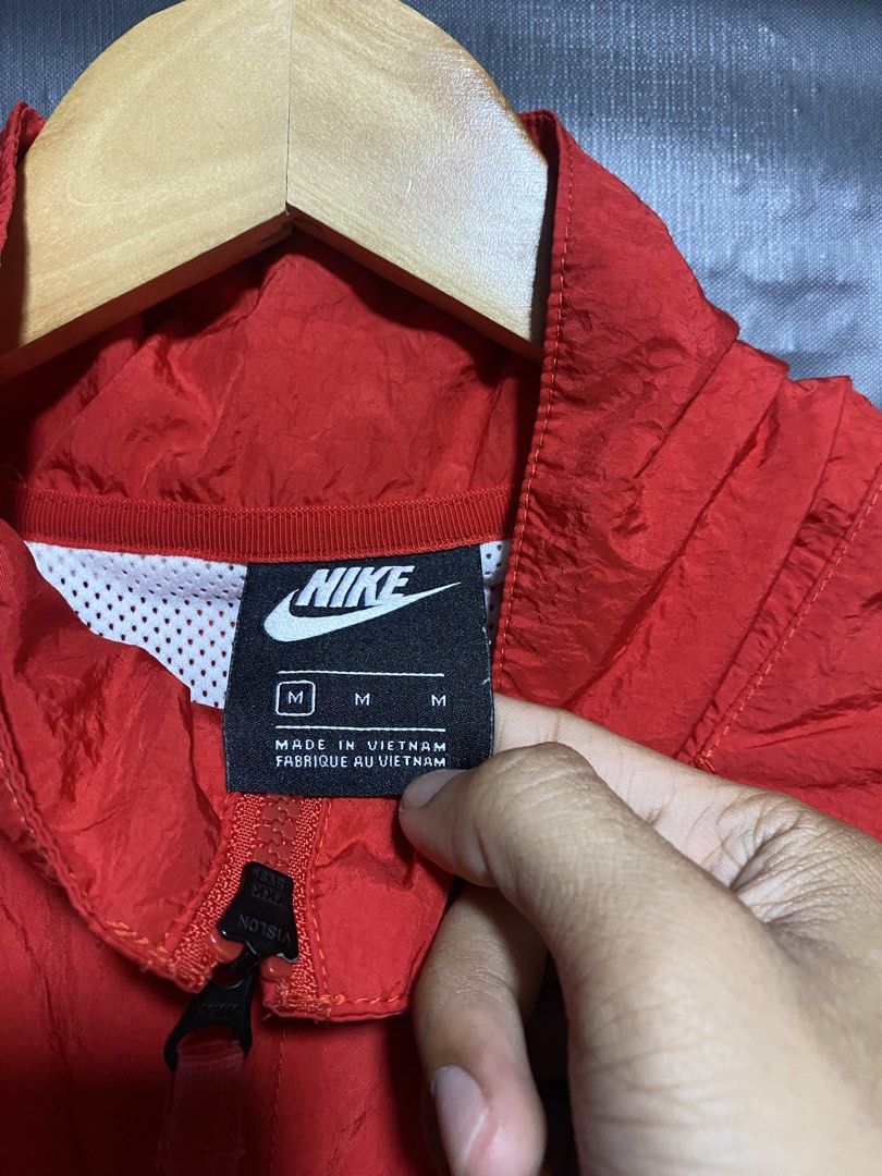 Nike Red White Swoosh Windbreaker Jacket (Category: Coats, Jackets and Outerwear) located in Antipolo. Submitted by drop.thrifts (Listing ID 1470242889, Image 2). Description: - Brand: Nike - Item: Red windbreaker jacket with iconic huge white swoosh across front and sleeves - Size: M (Regular fit) - Material: 100% Nylon body, 100% Polyester panels and mesh lining - Origin: Made in Vietnam - Features: Full zip closure, high collar, breathable mes