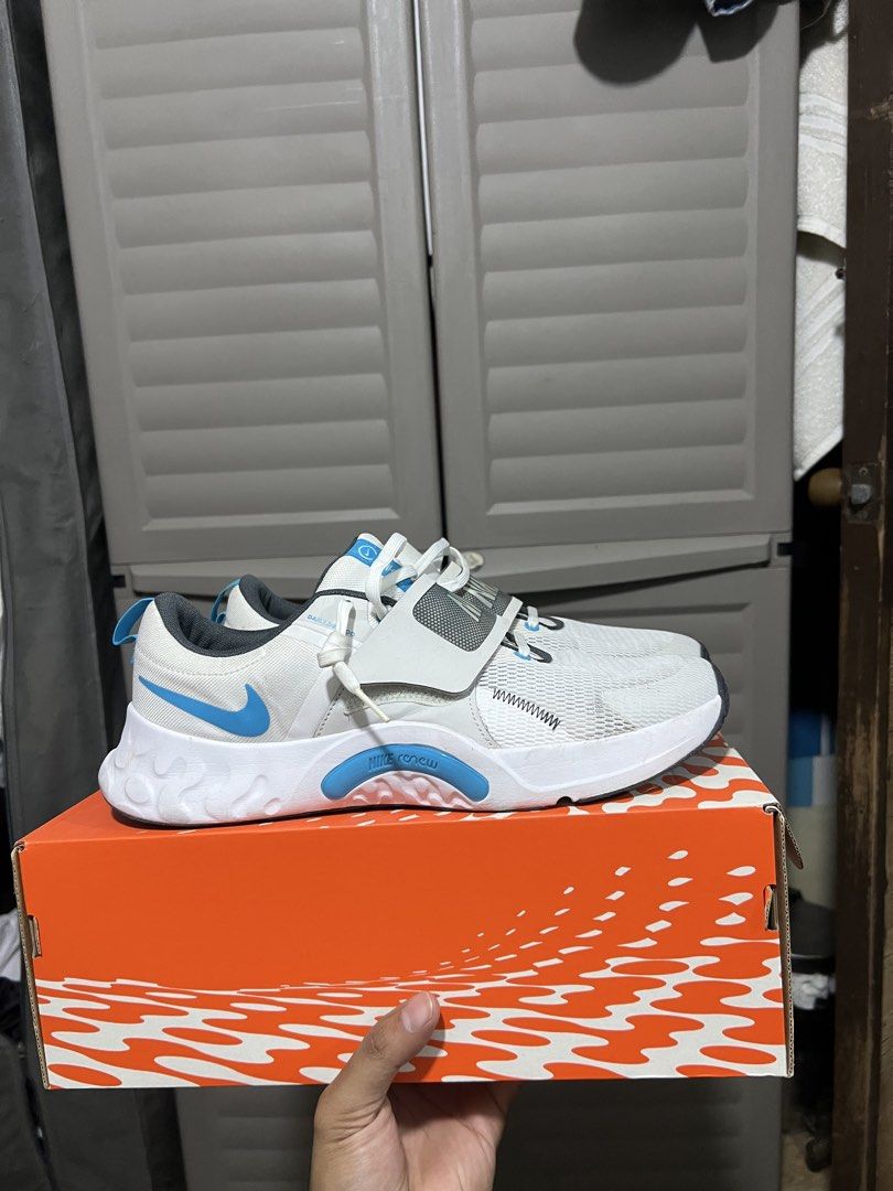 Nike Renew Retaliation 4 White Blue Lightning (Category: Sneakers) located in Manila. Submitted by galfredca71333 (Listing ID 1470326845, Image 3). Description: - Brand: Nike Renew Retaliation 4 - Color: White and Blue Lightning - Size: Men's US 10.5 / UK 9.5 / EUR 44.5 - Support: Midfoot strap for extra lockdown - Upper: Textured, breathable mesh - Sole: Cushioned for gym workouts and running - Packaging: Includes original orange printed box.