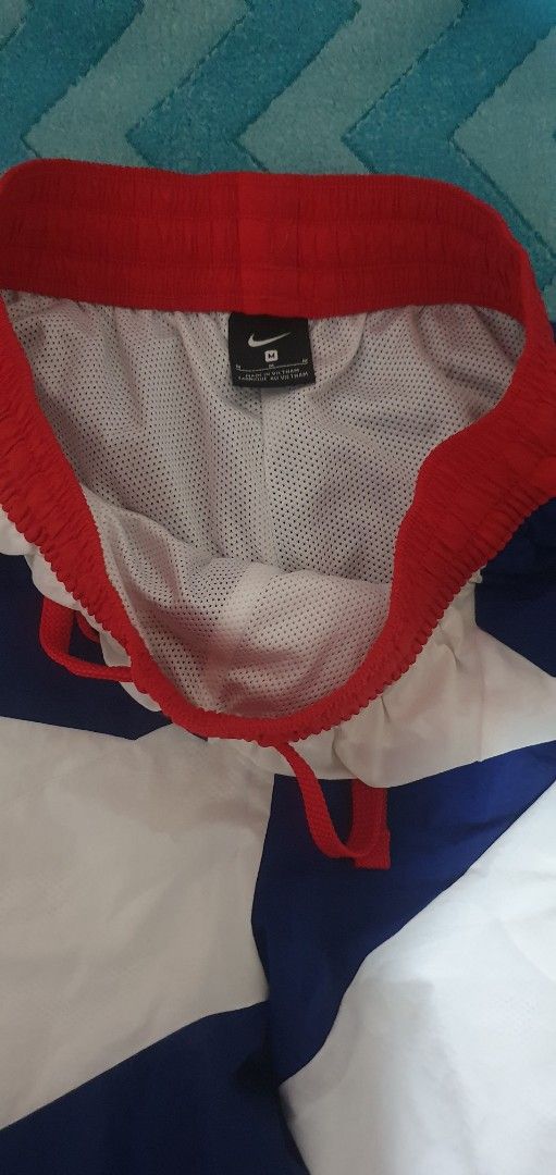 Nike Retro Star Patterned Swim Shorts (Category: Swim Trunks & Board Shorts) located in Manila. Submitted by koneho311 (Listing ID 1470170360, Image 2). Description: - Brand: Nike - Colors: Blue, White, and Red with bold star pattern - Size: Medium (M) - Features: Elastic waistband, red drawstring, and inner mesh lining - Origin: Made in Vietnam - Condition: Good pickup for summer or casual wear.