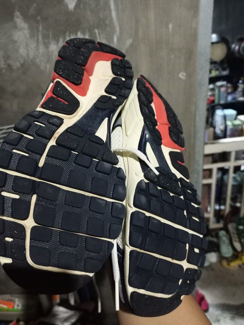 Nike Vomero 5 White Red Blue (Category: Sneakers) located in Mabalacat. Submitted by hasashoe (Listing ID 1470280746, Image 3). Description: - Brand: Nike Vomero 5 - Colorway: White with red and navy blue accents - Style: Chunky retro runner with mesh upper and cage overlays - Comfort & Grip: Cushlon foam midsole and durable rubber outsole - Condition: Great everyday pair, clean outsoles, and minimal wear on treads - Inclusions: Comes with origin