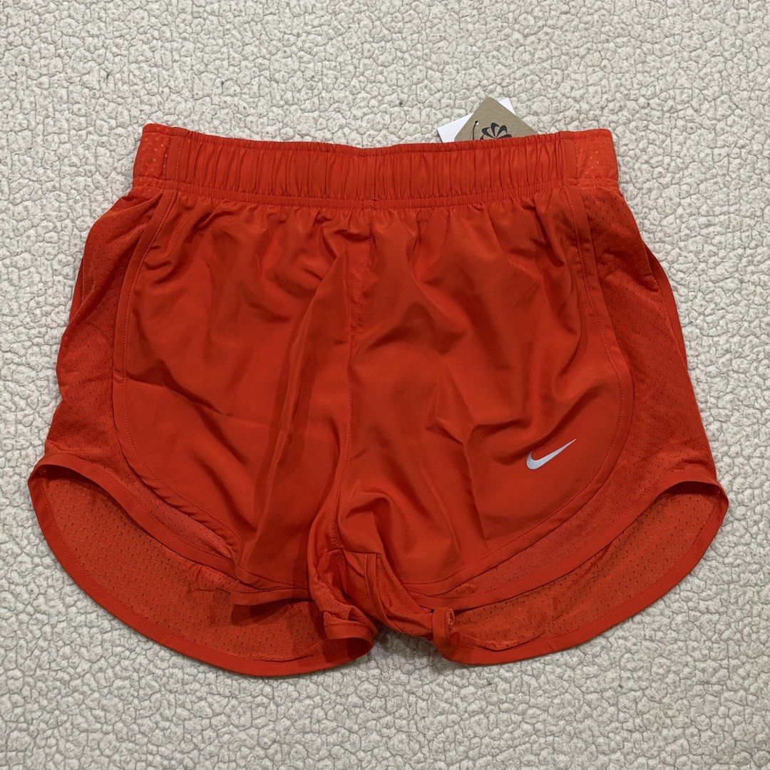 Nike Women's Athletic Shorts (Category: Activewear) located in Bacoor. Submitted by cookiedump (Listing ID 1470233630, Image 3). Description: - Brand: Nike - Colors: Burgundy, orange, and black - Styles: Running shorts with mesh side panels and Nike Pro compression shorts - Features: Elastic waistbands and drawstrings on selected pairs - Condition: Brand new with original store tags attached - Ideal for: Workouts, gym sessions, and casual wear Fo