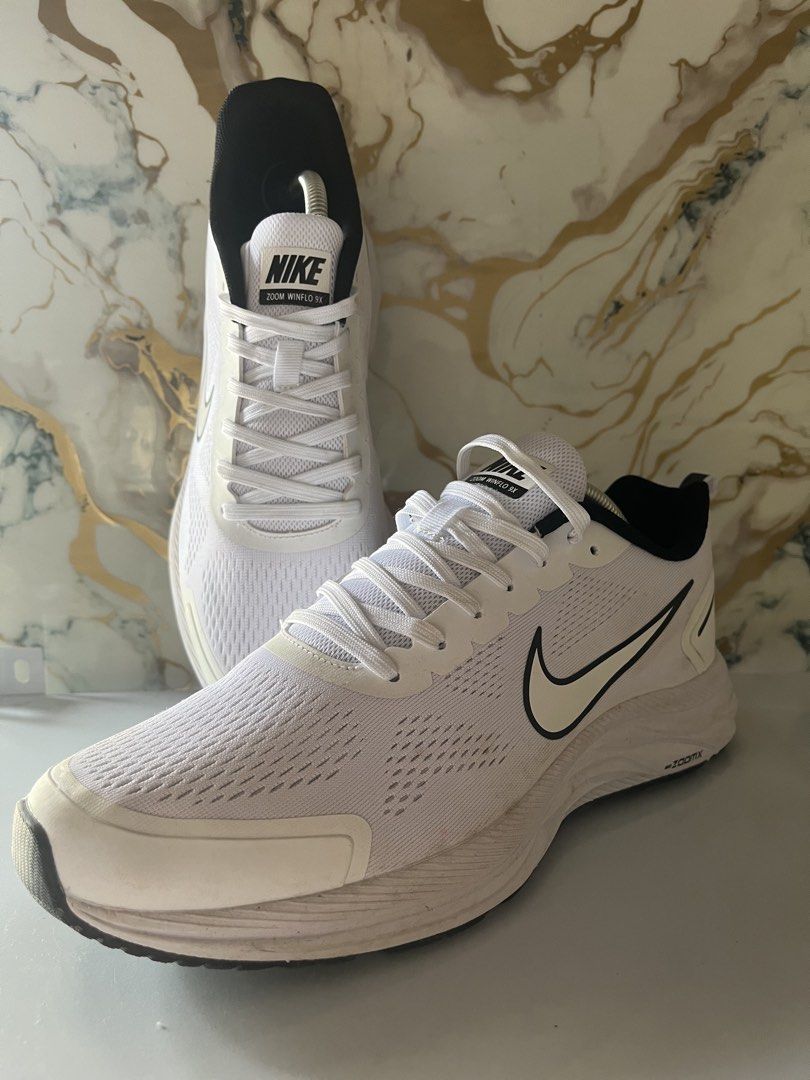 Nike Zoom Winflo 9 White Black US 10 (Category: Sneakers) located in Manila. Submitted by lkiss13 (Listing ID 1470180072, Image 2). Description: - Brand/Model: Nike Zoom Winflo 9 - Colorway: White and Black (Classic & Versatile) - Size: US 10 / Euro 44 - Features: Lightweight mesh upper & cushioned ZoomX technology sole - Condition: Clean uppers with minor dirt on outsoles from light use.
