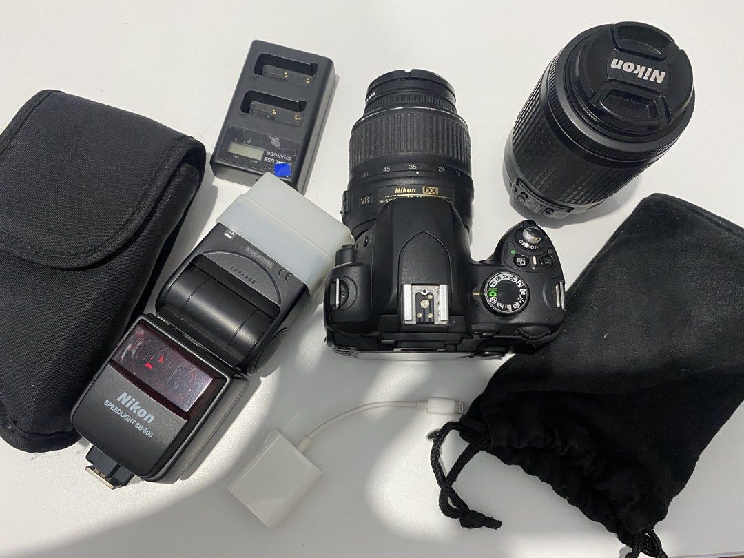 Nikon DSLR Camera Bundle with Lenses and Flash (Category: Cameras) located in Manila. Submitted by venicezam20 (Listing ID 1470254904, Image 1). Description: - Complete Nikon DX camera setup, ready for use - Includes two versatile lenses - Nikon Speedlight SB-600 flash with soft diffuser included - Dual USB battery charger with charging cable - Two protective pouches for safe storage - Screen powers on and functions normally - Compact kit that pa