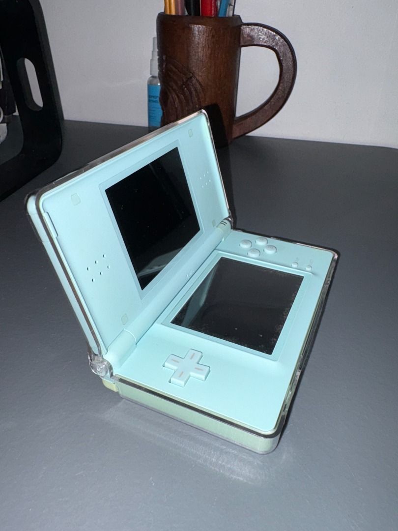 Nintendo DS Lite Light Blue (Category: Nintendo) located in Quezon City. Submitted by zeusdclutters (Listing ID 1470307799, Image 3). Description: NO MAJOR FLAWS WITH CONSOLE - Bottom screen has few vignette-forming dirt under the screen (refer to last 2 images) but has no problem with touch screen and stylus function - All buttons are working and responsive - Volume is adjustable, speakers are loud, earphone jack slot good - No issues with charg