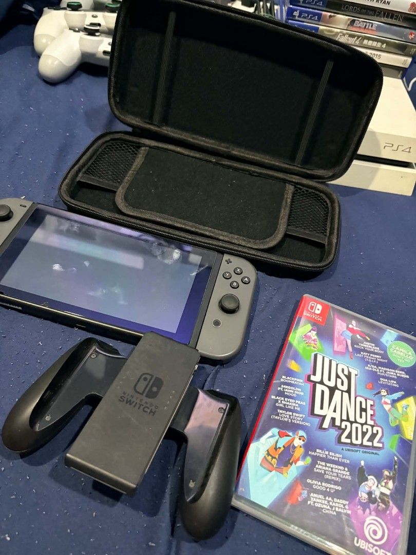 Nintendo Switch Console with Carrying Case and Just Dance 2022 (Category: Nintendo) located in Quezon City. Submitted by xelramos22 (Listing ID 1470299811, Image 1). Description: - Nintendo Switch Console (Grey) with screen protector applied - Joy-Con controllers and Joy-Con grip accessory included - Includes a durable black hard-shell carrying case - Comes with Just Dance 2022 physical game cartridge - Fully tested, works great, and ready for ga