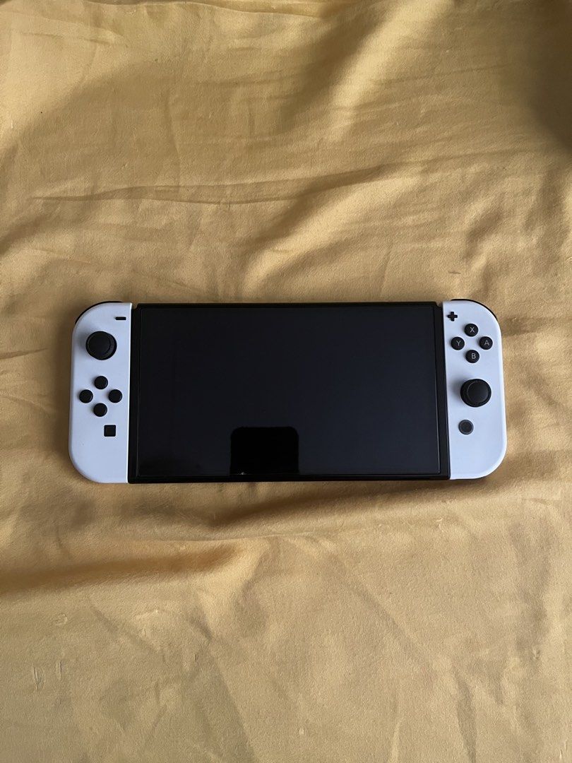 Nintendo Switch OLED + Memory Card (Category: Nintendo) located in Paranaque City. Submitted by labardss (Listing ID 1470203199, Image 3). Description: 🎮 FOR SALE: NINTENDO SWITCH OLED BUNDLE + GAMES 📌 All items were originally purchased from DataBlitz at their original retail prices. Nintendo Switch OLED Bundle – ₱18,000 Includes: • Nintendo Switch OLED Console • SD Card • Carrying Case • 2 pcs. Racing Wheel Controllers • Original box and acce