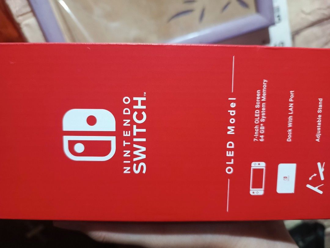 Nintendo Switch OLED Model Console (Category: Nintendo) located in Pasay City. Submitted by janloydp (Listing ID 1470179887, Image 3). Description: - Model: Nintendo Switch OLED Model (Southeast Asia Region) - Condition: Brand new, box opened for checking only (never played/used) - Storage: 64GB - Display: Vibrant 7-inch OLED screen - In the Box: Console, Joy-Con controllers (L/R), Joy-Con grip, Joy-Con straps, Nintendo Switch dock with LAN port,